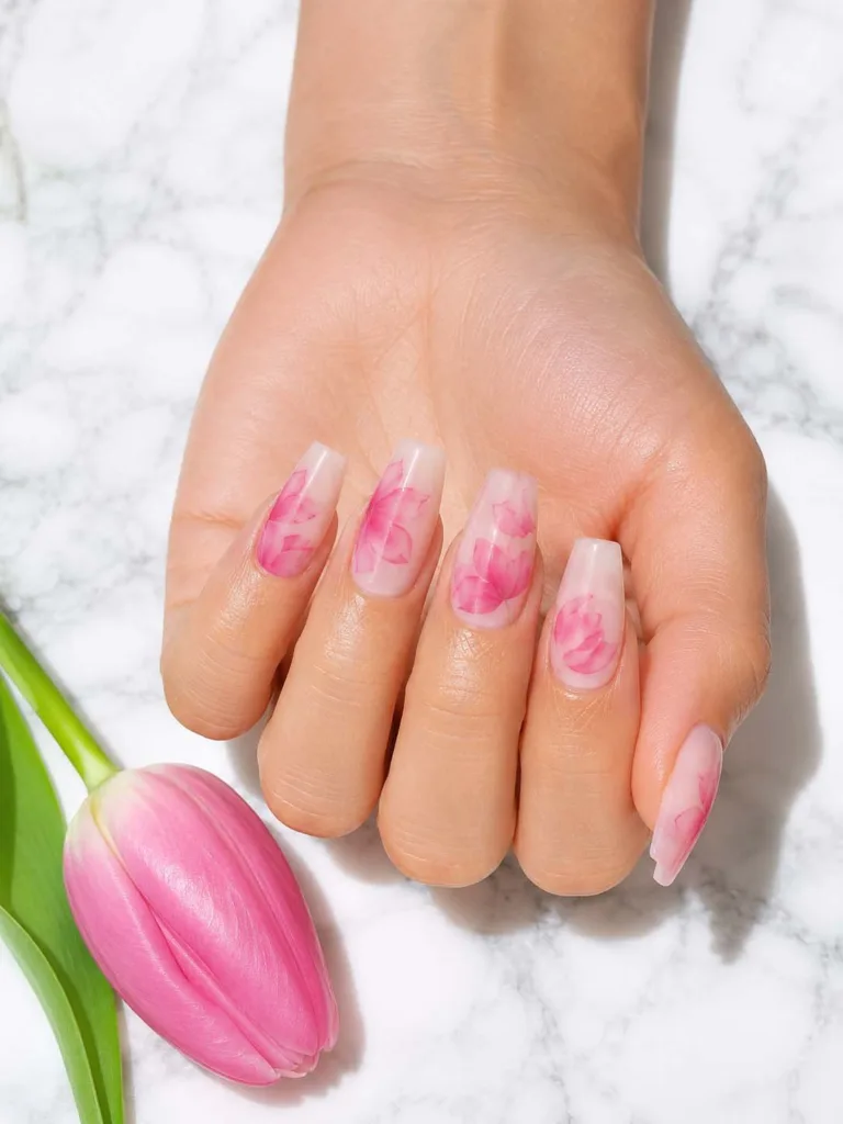 Milky pink coffin nails with soft watercolor blooming gel tulip petals in blush and rose tones on a creamy base