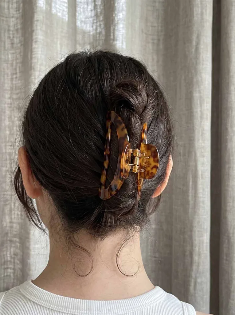 large claw clip updo on dark hair quick easy hairstyle under 2 minutes