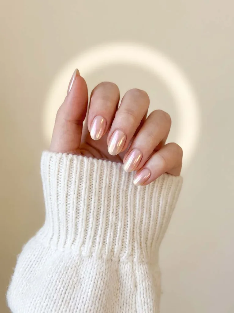glazed donut shimmer almond nails with iridescent pearlescent chrome finish on fair skin