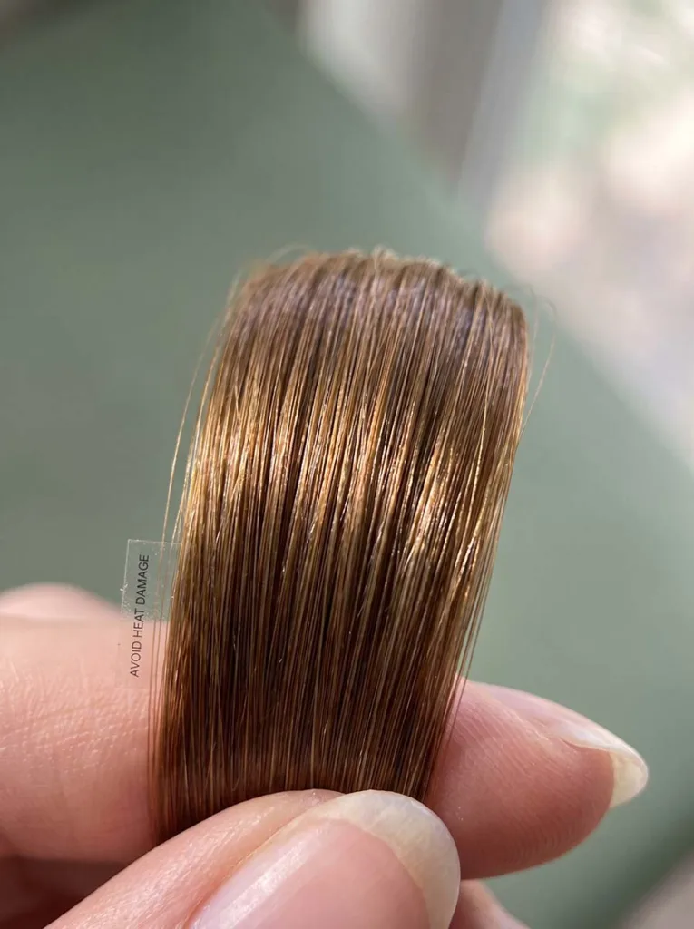 close-up of healthy shiny hair showing no heat damage from simple everyday hairstyles