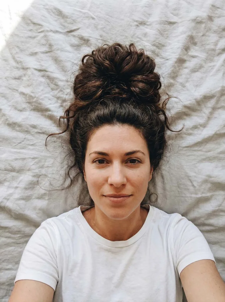 high messy bun on long hair — overhead shot showing bun texture and volume