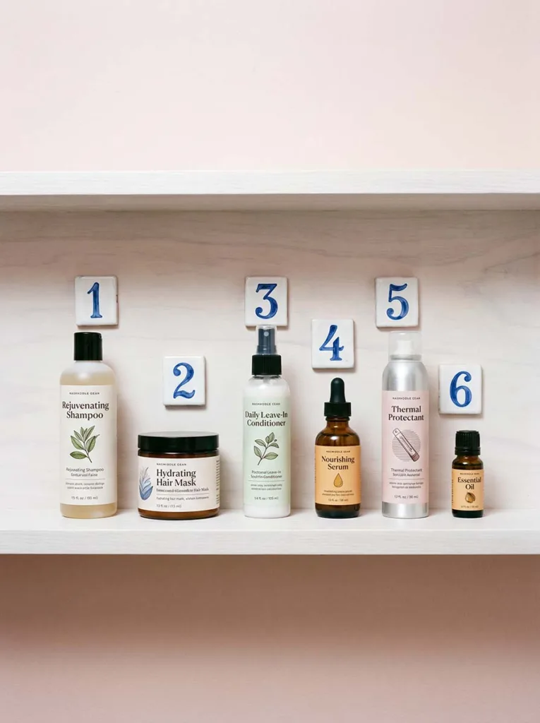 hair care products arranged in correct layering order on bathroom shelf step by step