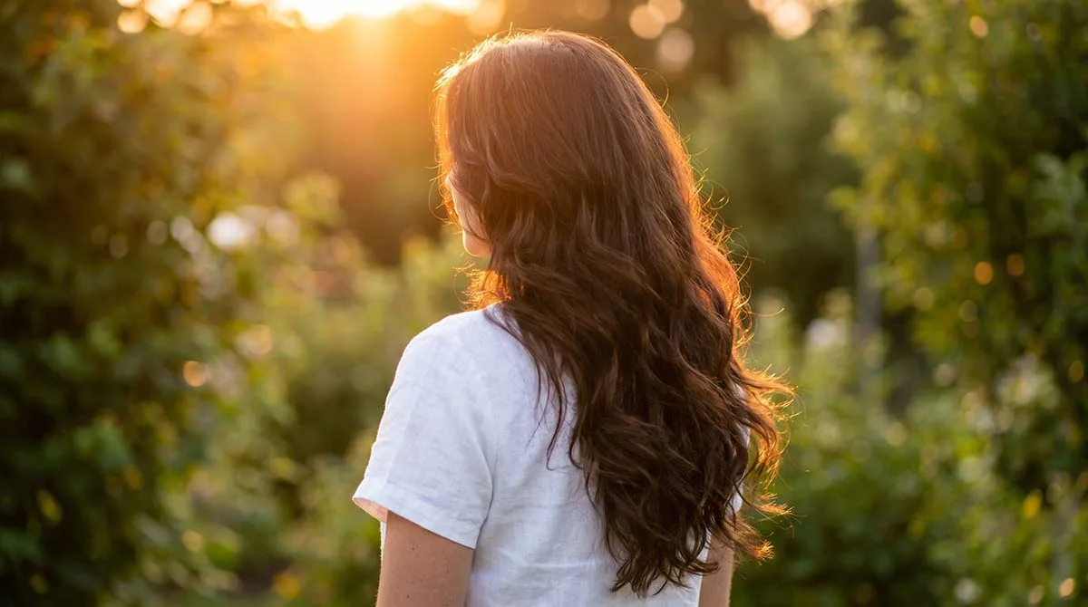 effortless long hair styles for women — flowing waves in warm natural light