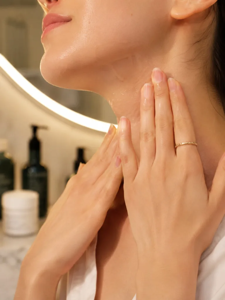Applying a Korean overnight sleeping mask to the jawline and neck