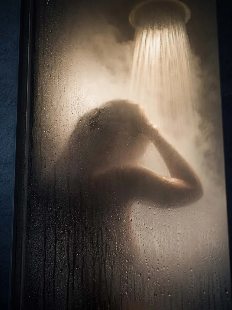 steamy hot shower with steam rising showing common winter skincare mistake that strips skin barrier