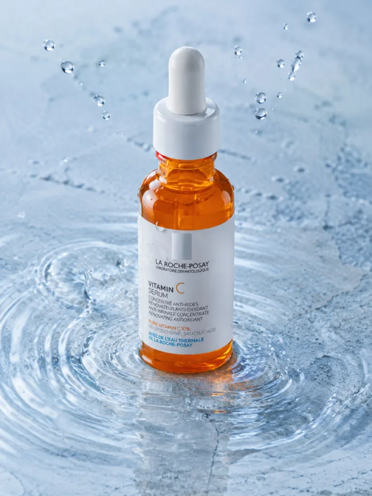La Roche-Posay Pure Vitamin C 10 Serum bottle with water droplets on stone
