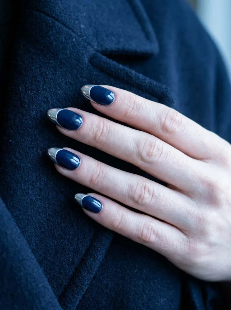 Navy blue winter nails with chrome French tip design