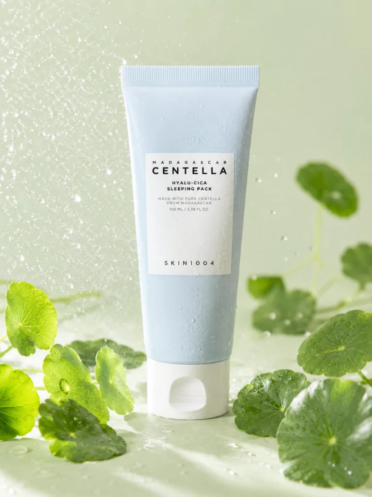 SKIN1004 Madagascar Centella Hyalu-Cica Sleeping Pack surrounded by fresh centella leaves