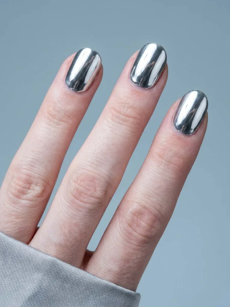 Silver chrome winter nails with mirror finish close-up