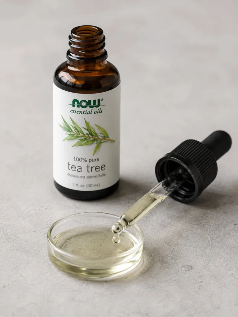 Diluted tea tree oil and carrier oil for spot-treating acne naturally