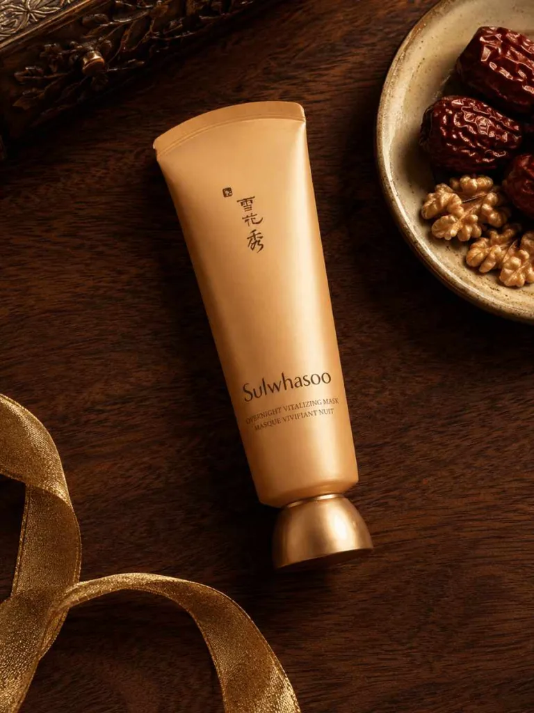 Sulwhasoo Overnight Vitalizing Mask jar styled with jujube and walnut on dark wood