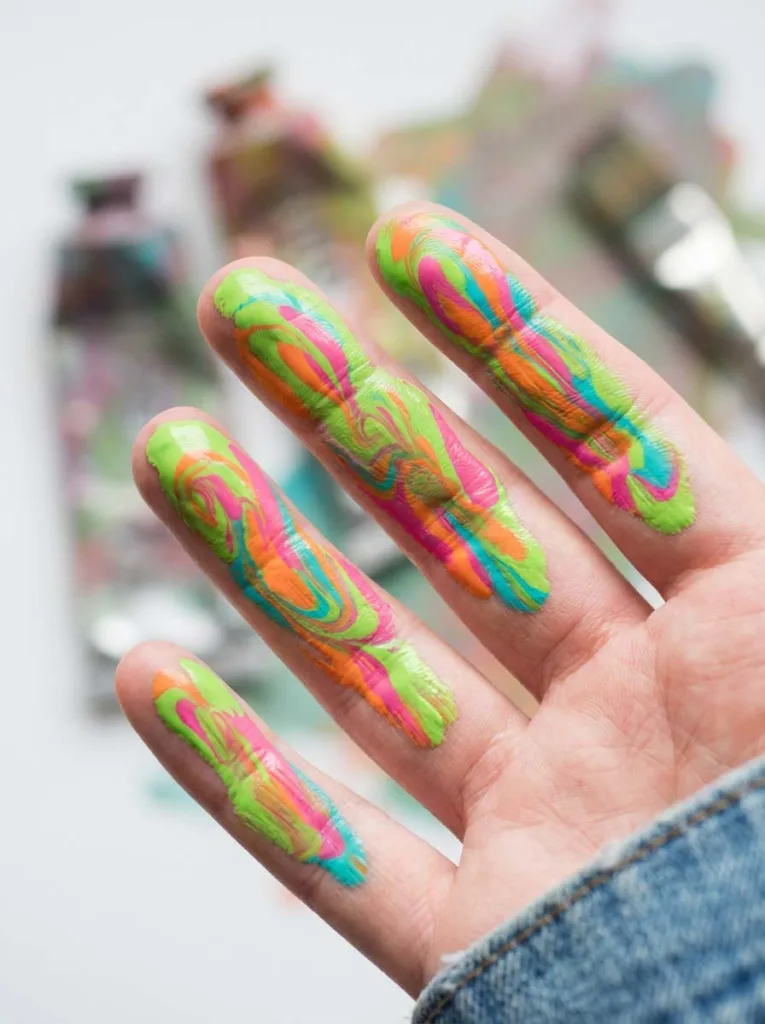 Abstract neon swirl nail art inspired by a painter's palette