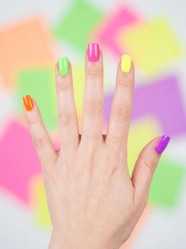 Neon color block nail design with a different shade on each nail