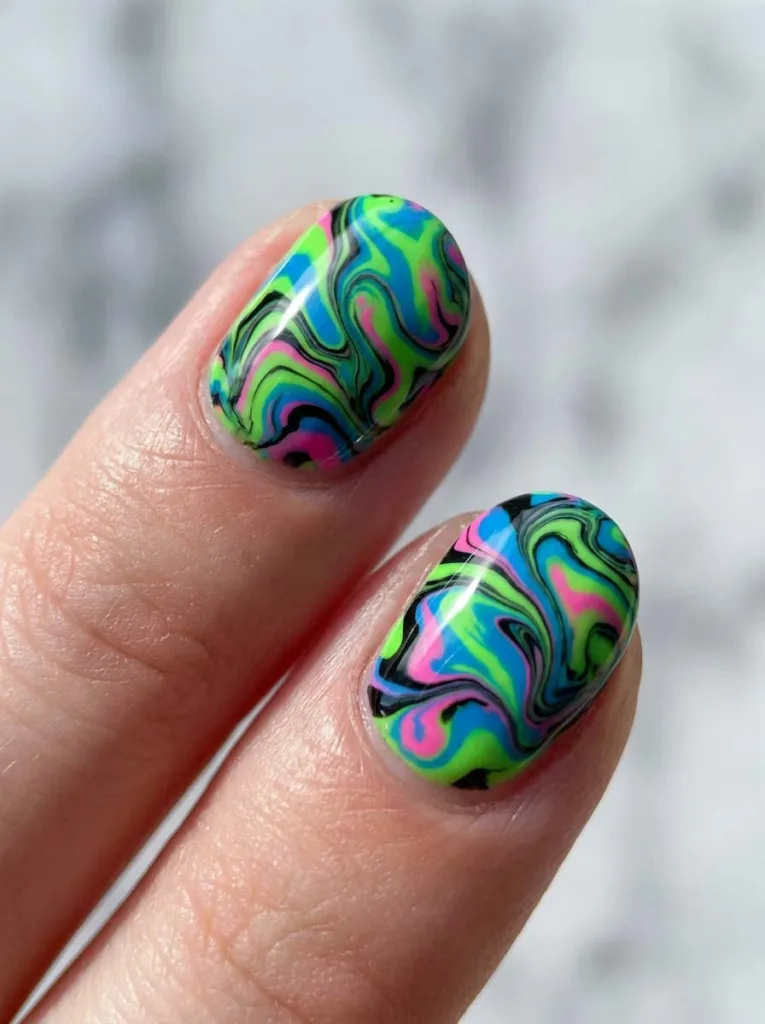Neon marble nail design swirled with black polish