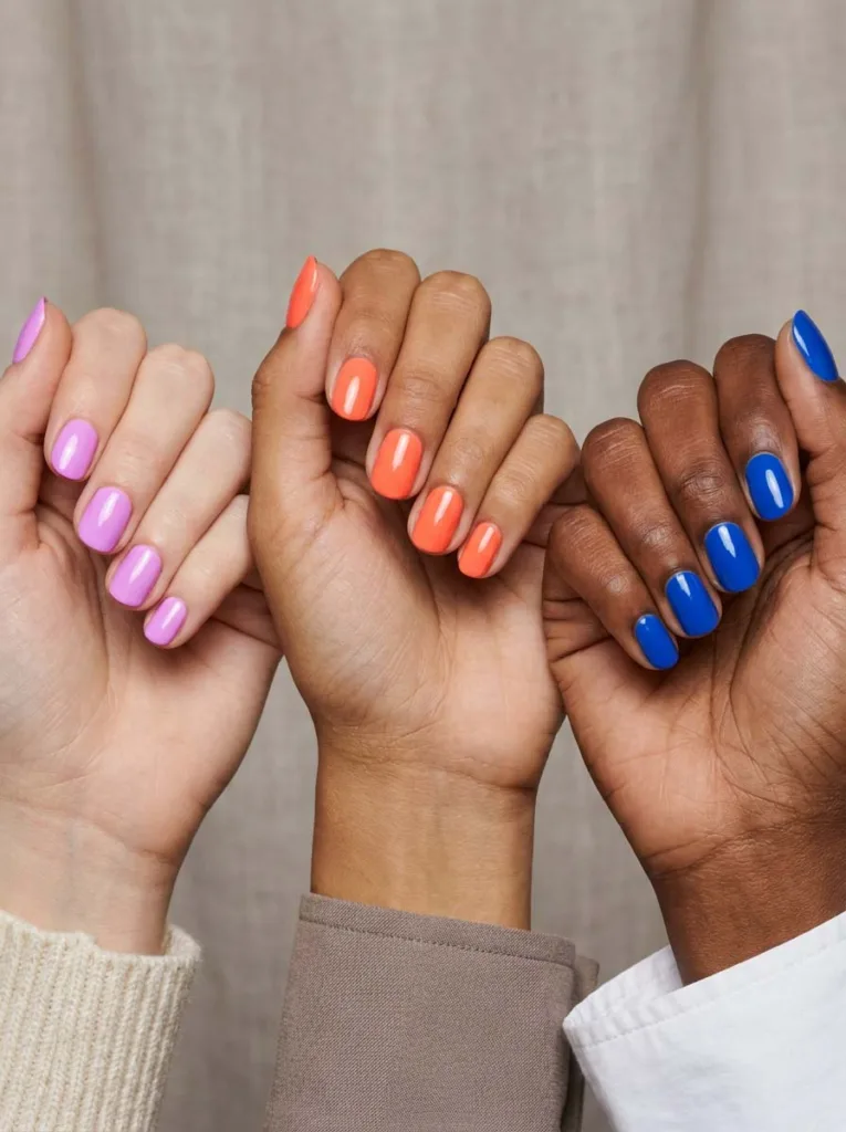 Neon nail polish shades compared across fair, olive, and deep skin tones