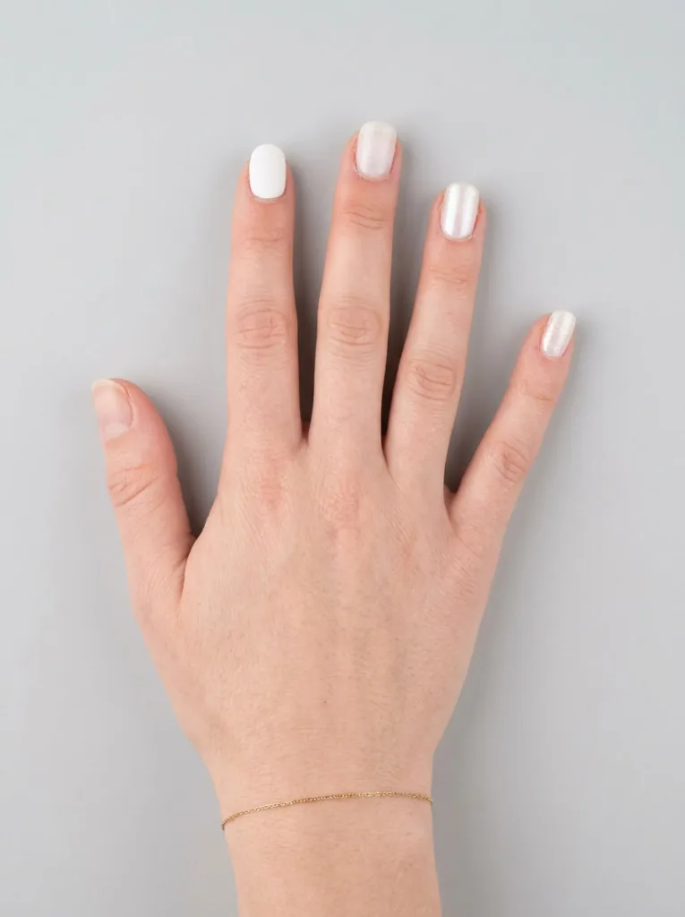 Comparison of pure, milky, pearl, and shimmer white nail polish shades