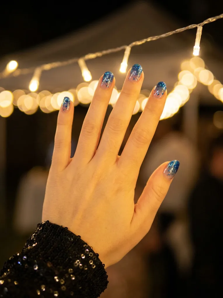 Blue glitter gradient winter nails for a festive holiday look