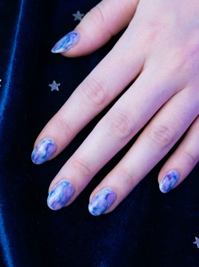 Cosmic aura ombre new years nails in blue and purple