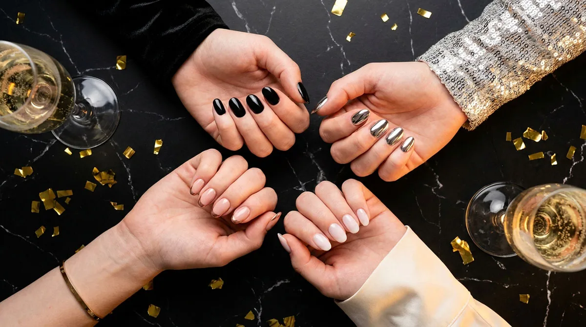 New years nails flat lay showing black, chrome, milky white, and rose gold manicure designs