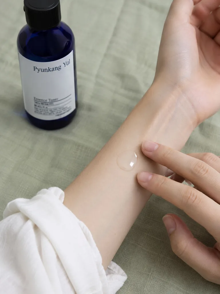 Close-up of jelly-textured Pyunkang Yul toner on skin showing its thicker consistency