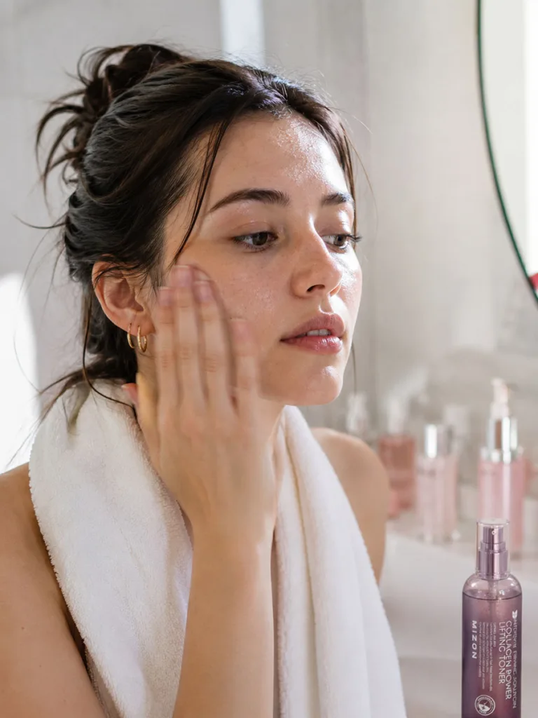 Woman patting on multiple layers of toner using the seven-skin method
