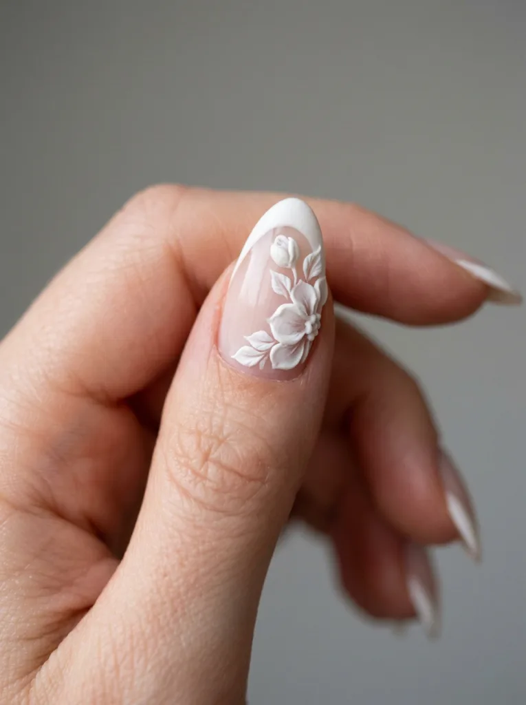3D floral tip wedding nails showing raised sculpted texture in macro detail