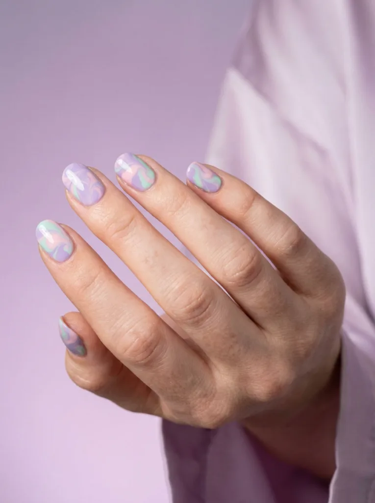 Marble pastel easter nails with swirled lavender pink and mint polish