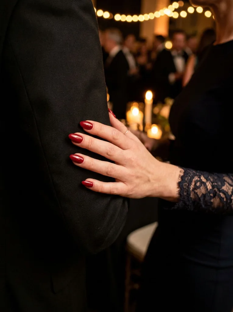 Classic red wedding manicure at a black-tie evening reception