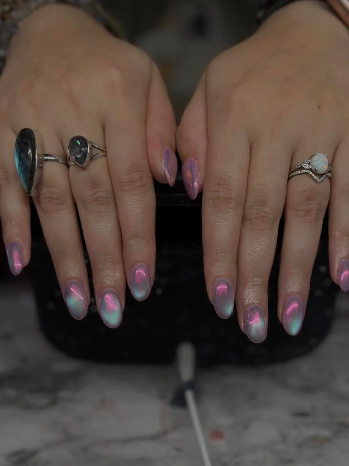 Oval nails with smooth pink, lilac and pale aqua iridescent shine